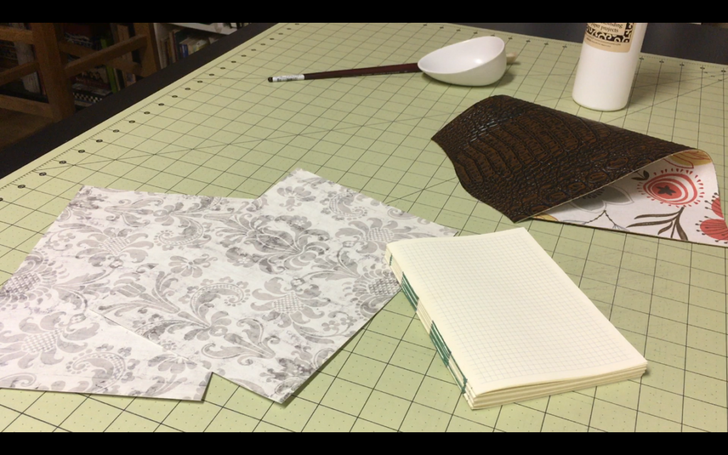 Applying the mull and cardstock to the text block #bookbinding