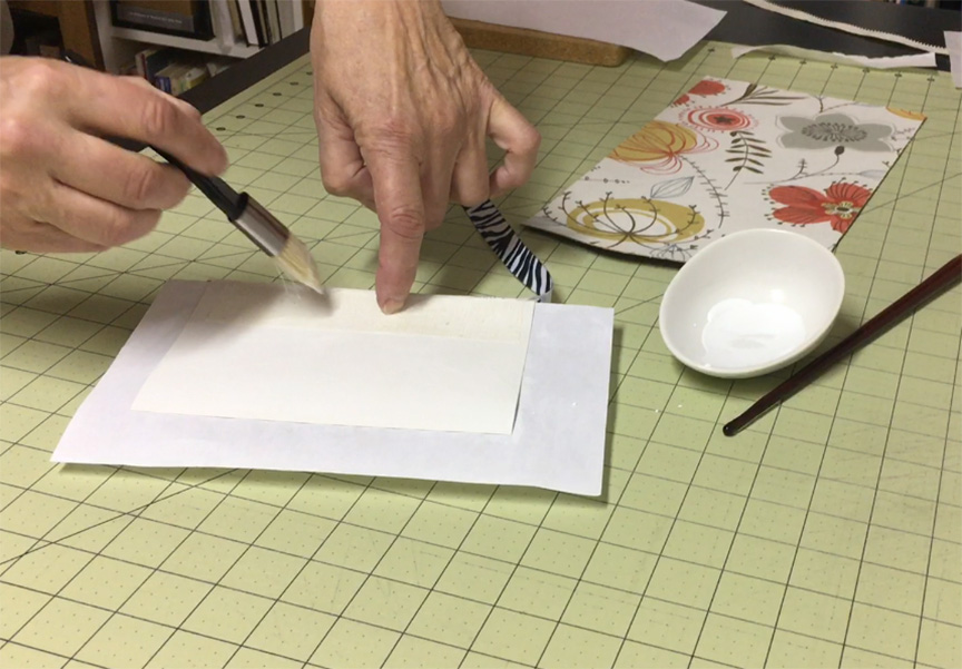 Applying the mull and cardstock to the text block #bookbinding